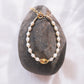 White Freshwater Pearl Bracelet with Gold Pikake Bead - Pōhina