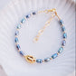 Peacock Freshwater Pearl Bracelet with Gold Pikake Bead - Haʻihaʻi