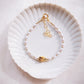 White Freshwater Pearl Bracelet with Gold Pikake Bead - Pōhina