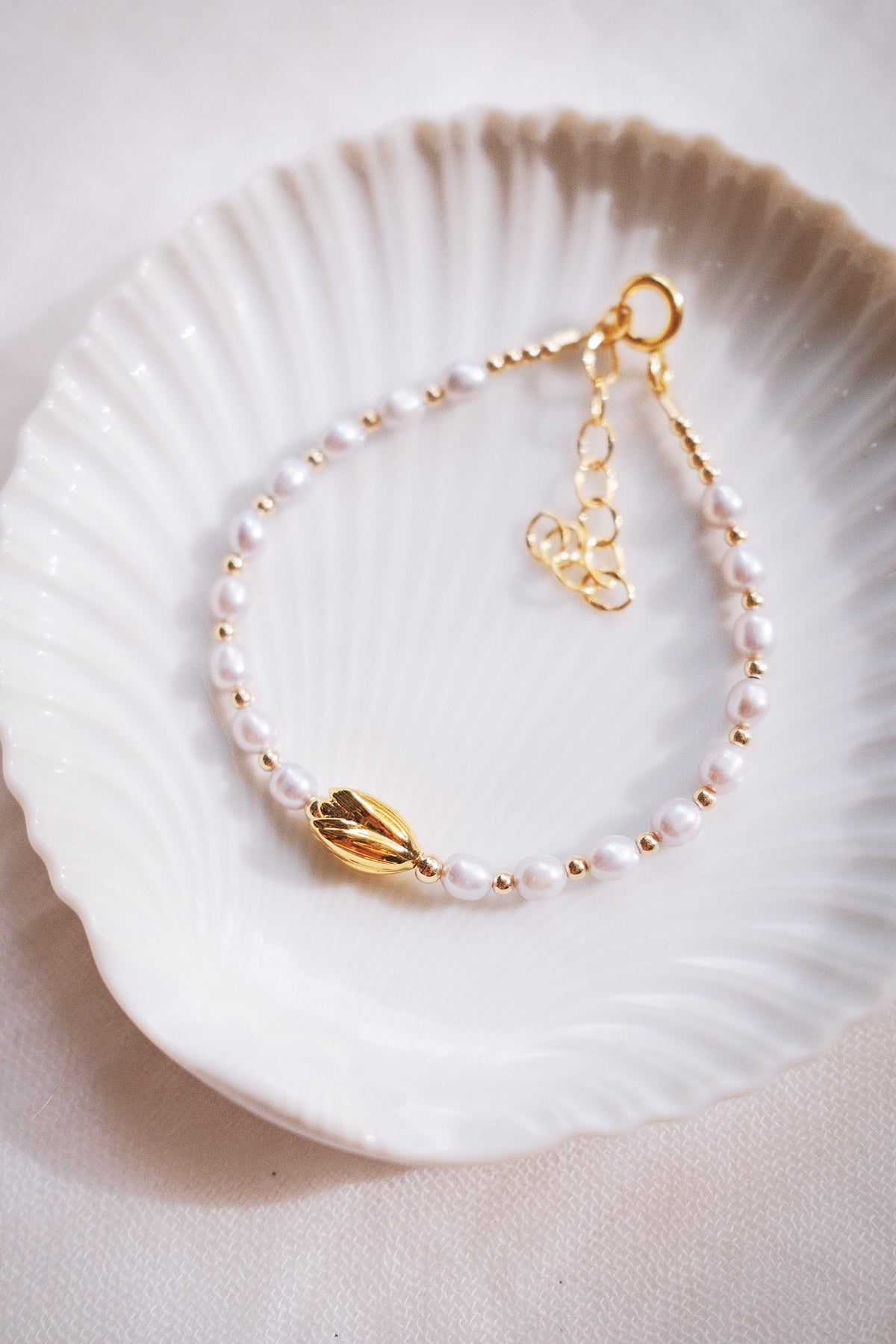 White Freshwater Pearl Bracelet with Gold Pikake Bead - Pōhina