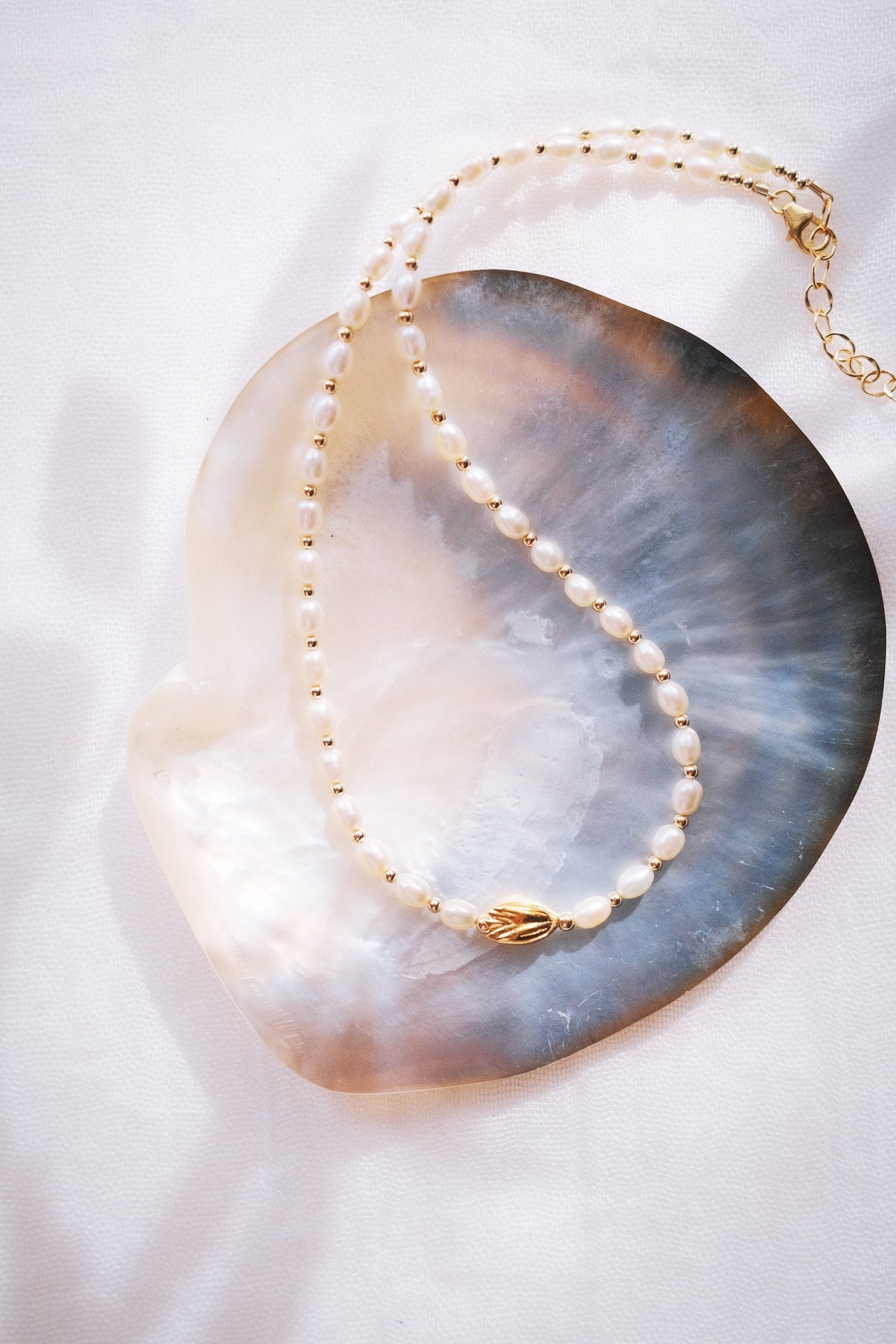 White Freshwater Pearl Necklace with Gold Pikake Bead - Pōhina